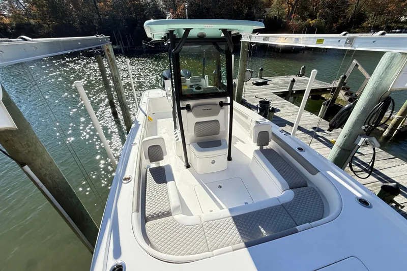 Slide: The Image of 2023 Caymas 281 HB boat docked, featuring spacious seating and sleek design. - 26