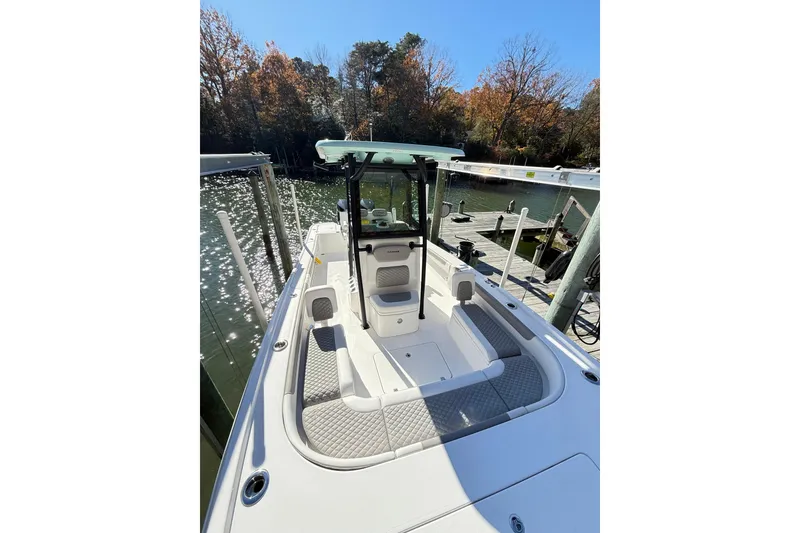 Slide: The Image of 2023 Caymas 281 HB boat docked by a scenic lakeside. - 27