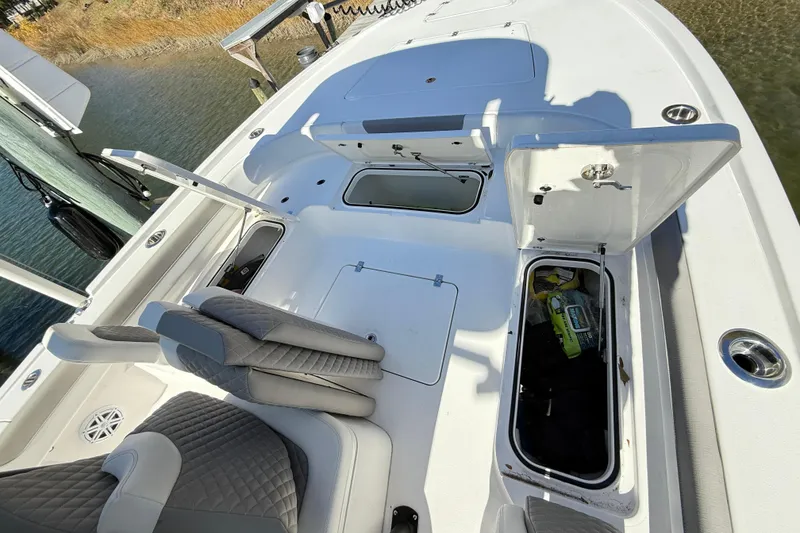 Slide: The Image of 2023 Caymas 281 HB boat interior with open storage compartments. - 31