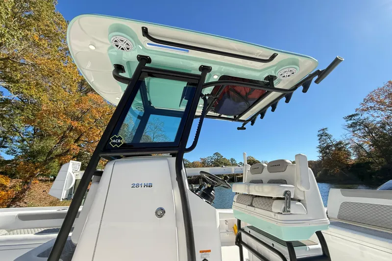 Slide: The Image of 2023 Caymas 281 HB boat with sleek design and modern features on a sunny day. - 39