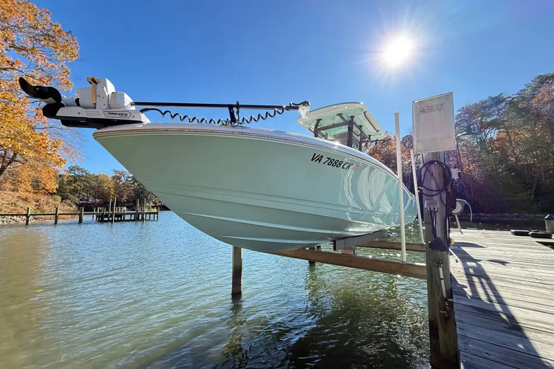 Slide: The Image of 2023 Caymas 281 HB boat docked on a sunny day by the water. - 4