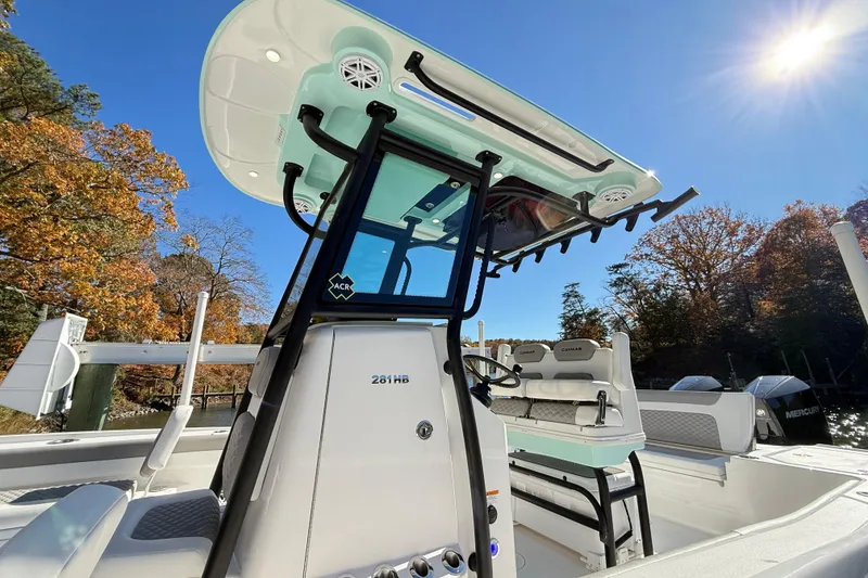 Slide: The Image of 2023 Caymas 281 HB boat with sleek design, set against a sunny autumn backdrop. - 40