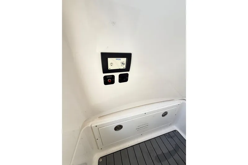 Slide: The Image of 2023 Caymas 281 HB boat interior control panel and flooring. - 45