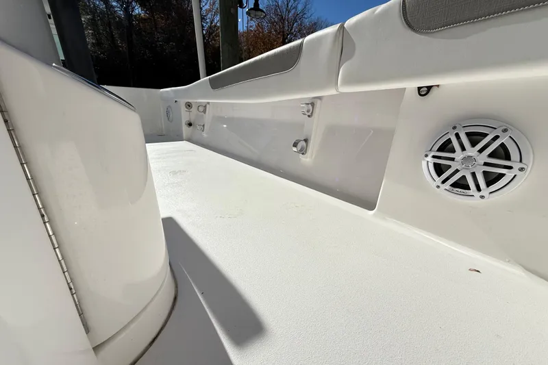Slide: The Image of 2023 Caymas 281 HB boat interior with speaker and seating detail. - 54