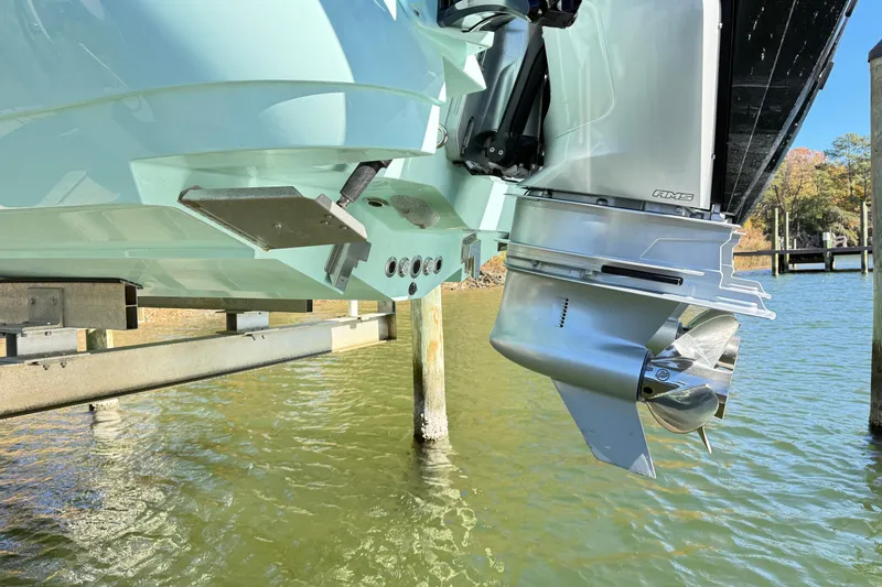 Slide: The Image of 2023 Caymas 281 HB boat engine and propeller above water. - 58