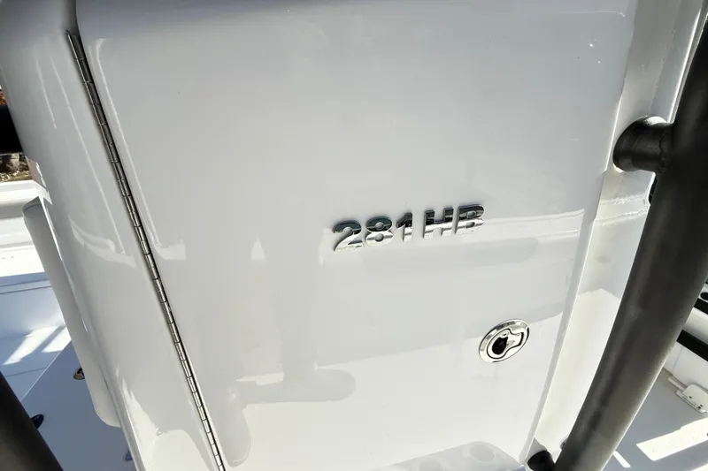 Slide: The Image of 2023 Caymas 281 HB boat detail with model emblem and sleek design. - 62