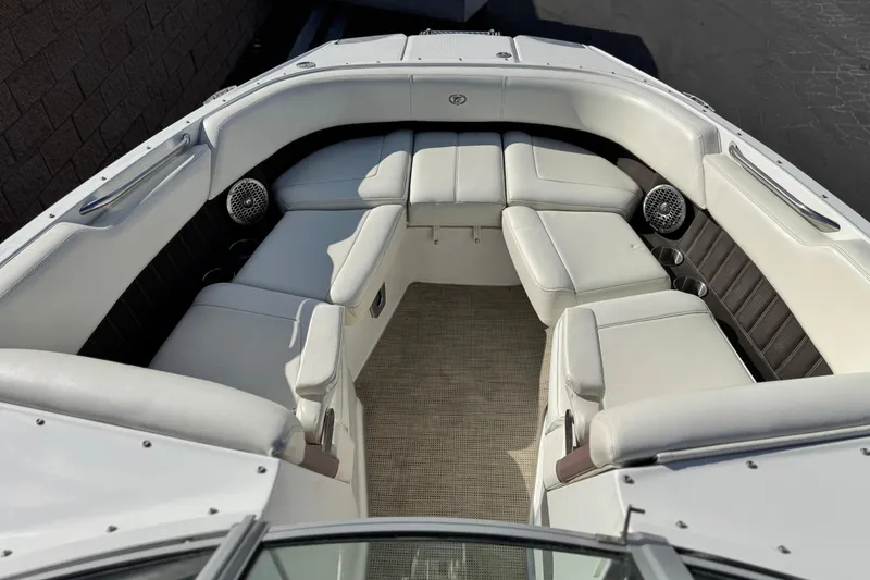 Slide: The Image of Luxurious seating area on a 2014 Cobalt 24SD boat with white upholstery. - 17