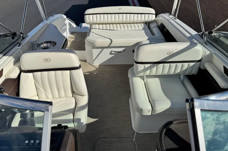Slide: The Image of 2014 Cobalt 24SD boat interior with white leather seating and modern design. - 22