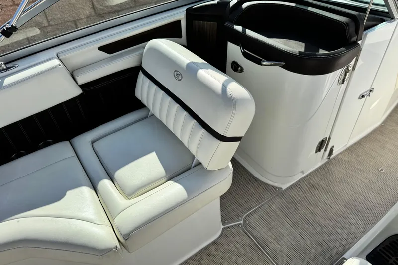 Slide: The Image of 2014 Cobalt 24SD boat interior with white seating and sleek design. - 31
