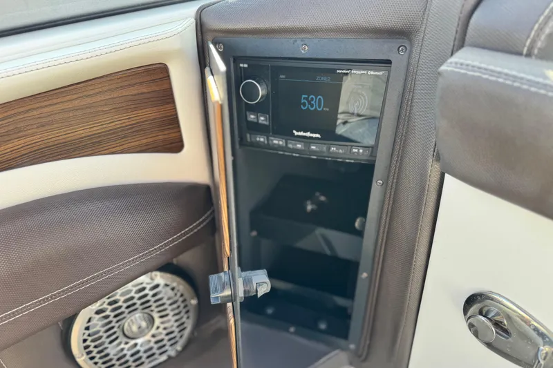 Slide: The Image of 2014 Cobalt 24SD boat interior with audio system and speaker detail. - 34