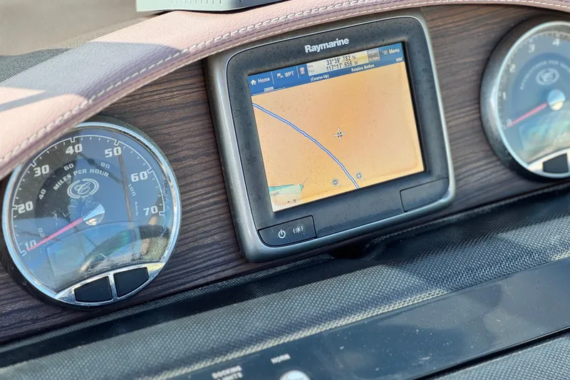 Slide: The Image of Dashboard of 2014 Cobalt 24SD with Raymarine GPS and speedometer. - 37