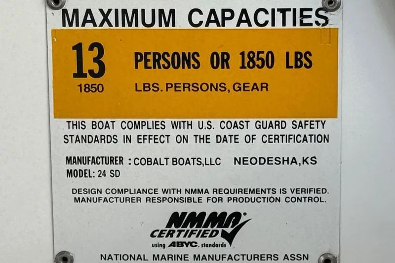 Slide: The Image of Capacity label for 2014 Cobalt 24SD boat: 13 persons or 1850 lbs. - 40