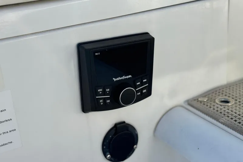 Slide: The Image of Control panel on 2014 Cobalt 24SD boat, featuring Rockford Fosgate audio system. - 9