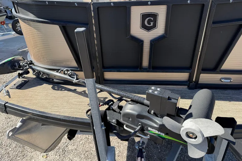 Slide: The Image of 2022 Godfrey Monaco 255 SFL boat interior with luxurious seating on a sunny day. - 13