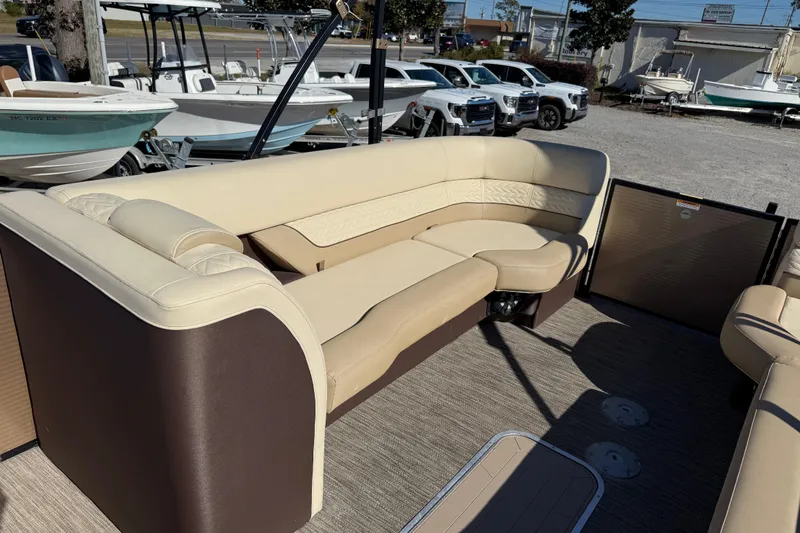 Slide: The Image of 2022 Godfrey Monaco 255 SFL boat dashboard with steering wheel and navigation display. - 17