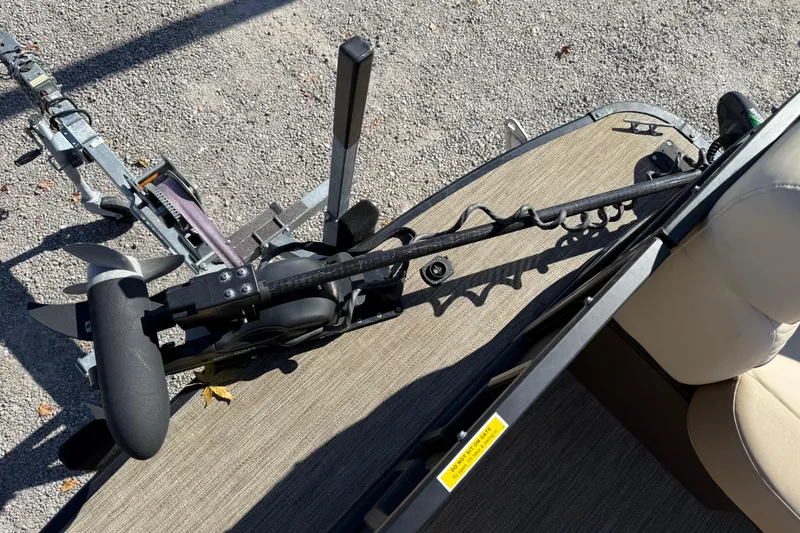 Slide: The Image of 2022 Godfrey Monaco 255 SFL pontoon boat on water, featuring spacious seating and modern dashboard. - 18