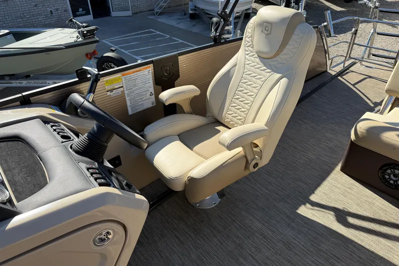 Slide: The Image of 2022 Godfrey Monaco 255 SFL boat with outboard motor on sunny waterway. - 22