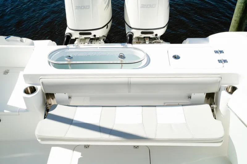 Slide: The Image of 2019 Sea Pro 259 Center Console boat with dual engines and seating area. - 15
