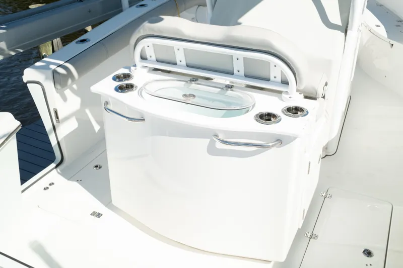 Slide: The Image of 2019 Sea Pro 259 Center Console boat interior with seating and storage features. - 18