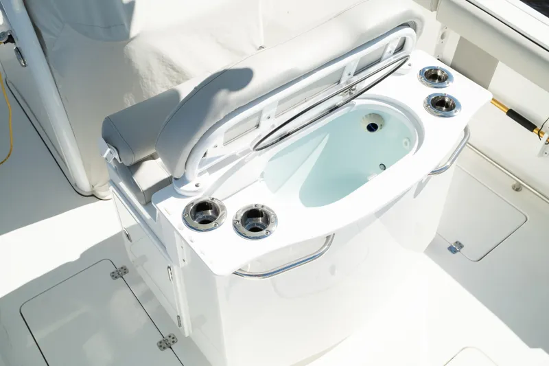 Slide: The Image of 2019 Sea Pro 259 Center Console boat with livewell and cup holders. - 19