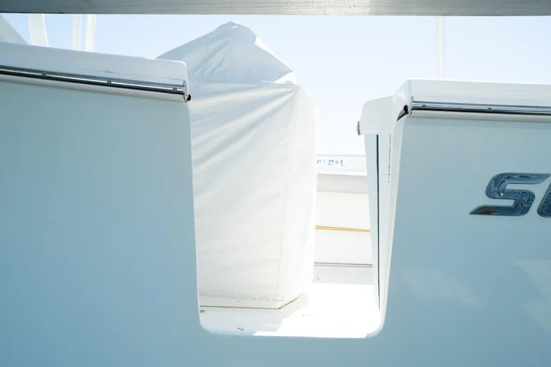 Slide: The Image of 2019 Sea Pro 259 Center Console boat with covered seating area. - 2