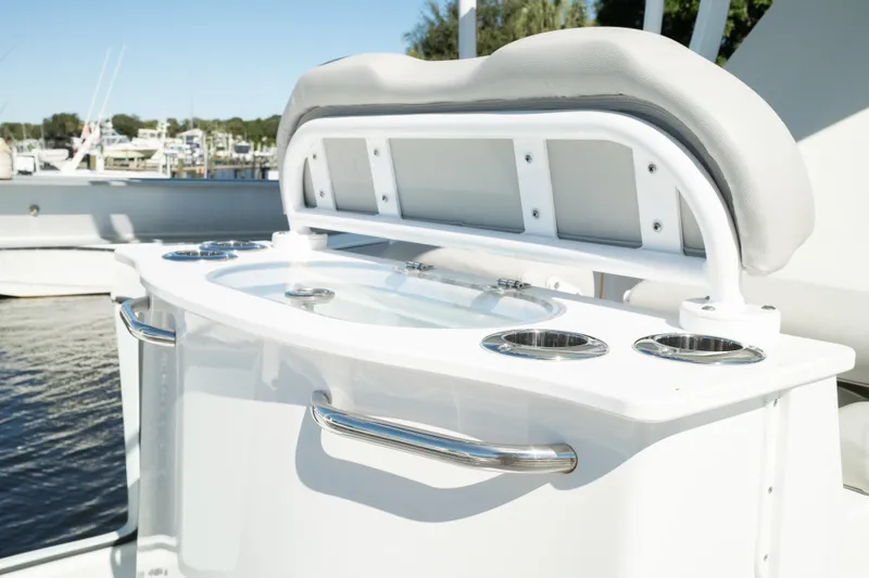 Slide: The Image of 2019 Sea Pro 259 Center Console boat with sleek seating and cup holders. - 21