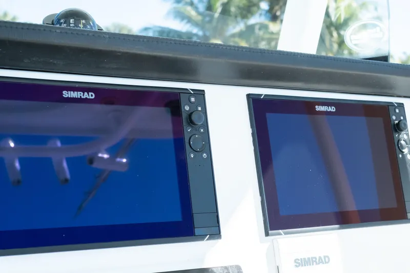 Slide: The Image of Simrad navigation screens on 2019 Sea Pro 259 Center Console boat dashboard. - 33