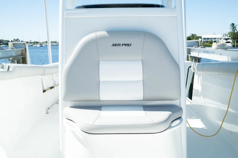 Slide: The Image of 2019 Sea Pro 259 Center Console boat seat with waterfront view. - 37