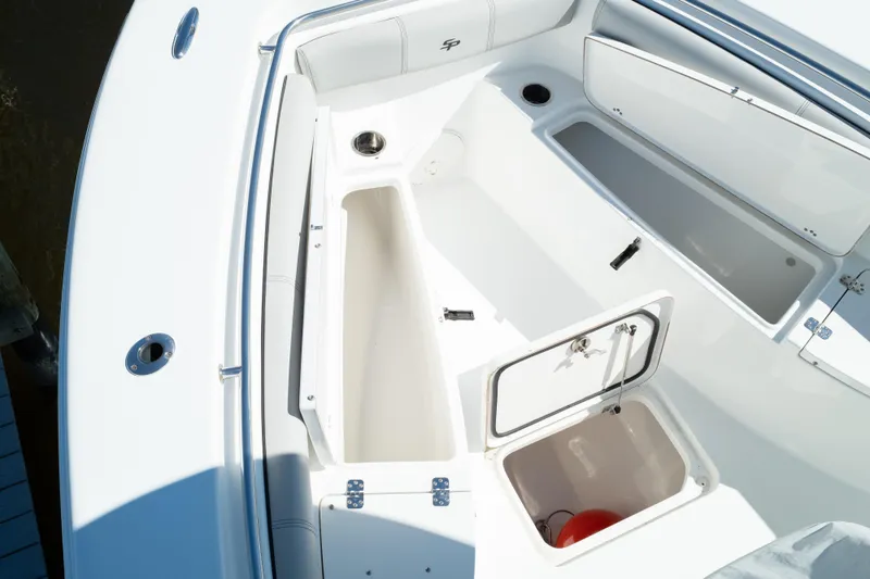 Slide: The Image of 2019 Sea Pro 259 Center Console boat with open storage compartments. - 47
