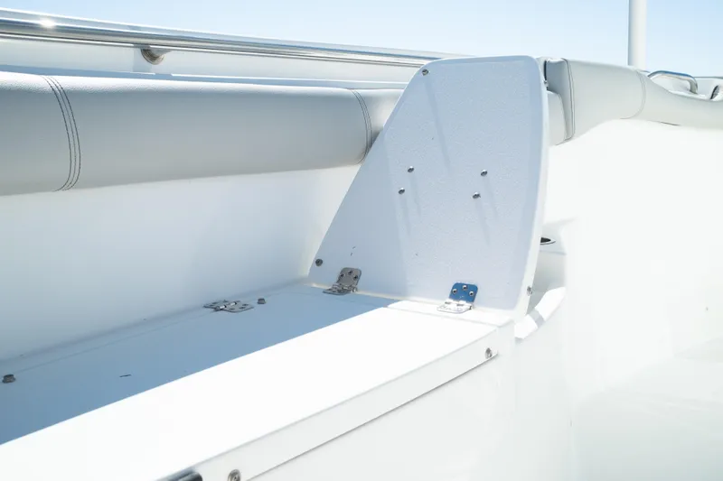 Slide: The Image of 2019 Sea Pro 259 Center Console boat interior with white seating and stainless steel rail. - 48
