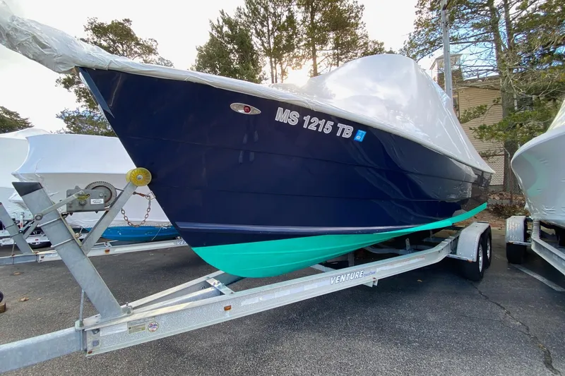 The Image of 2007 Roth Bilt 24 CC boat on trailer, covered, parked outdoors. - 0