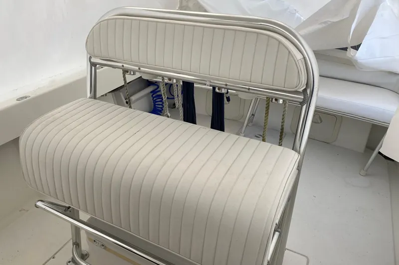 Slide: The Image of 2007 Roth Bilt 24 CC boat interior with white cushioned seating. - 15