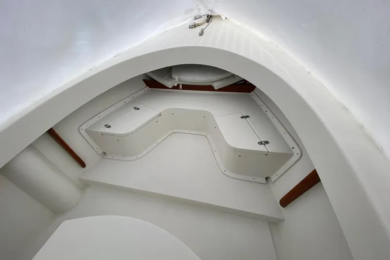 Slide: The Image of Interior view of 2007 Roth Bilt 24 CC boat, featuring white storage compartments. - 21