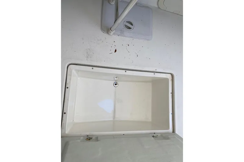 Slide: The Image of Open storage compartment on 2007 Roth Bilt 24 CC boat deck. - 26