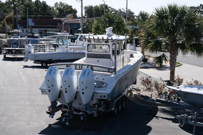 Slide: The Image of 2026 Solace 37 Pilot boat with triple engines in a marina setting. - 10