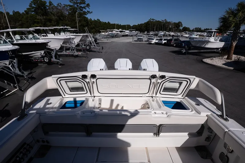 Slide: The Image of 2026 Solace 37 Pilot boat in a marina with multiple vessels. - 17