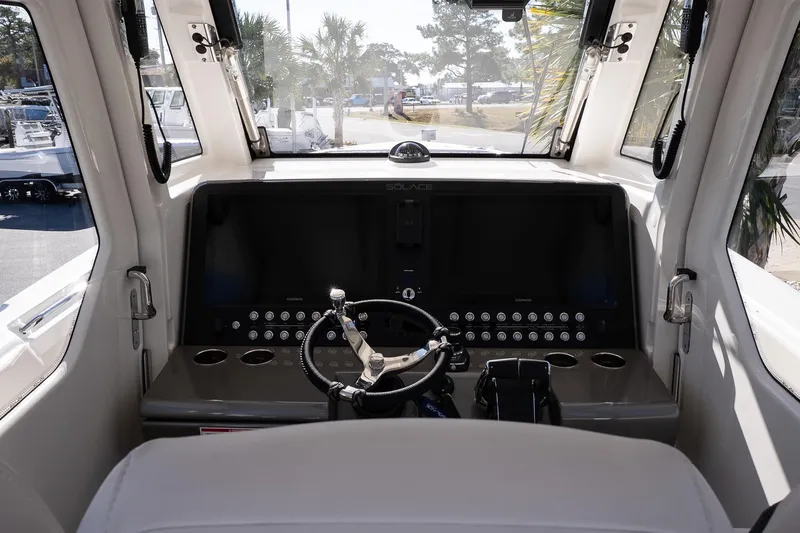 Slide: The Image of Interior cockpit of 2026 Solace 37 Pilot boat with modern controls and steering wheel. - 21