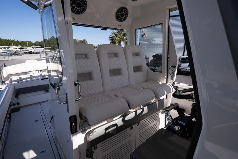 Slide: The Image of Luxurious interior seating of 2026 Solace 37 Pilot boat, featuring plush white upholstery. - 22