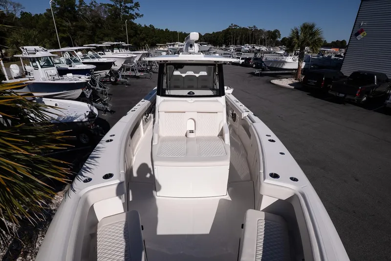 Slide: The Image of 2026 Solace 37 Pilot boat displayed in a marina with multiple vessels. - 28