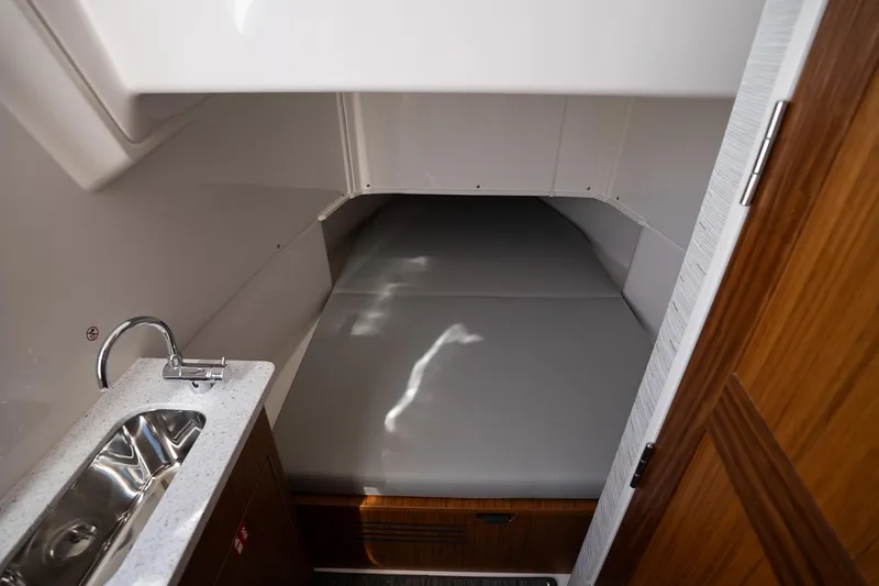 Slide: The Image of 2026 Solace 37 Pilot cabin interior with bed and sink. - 30