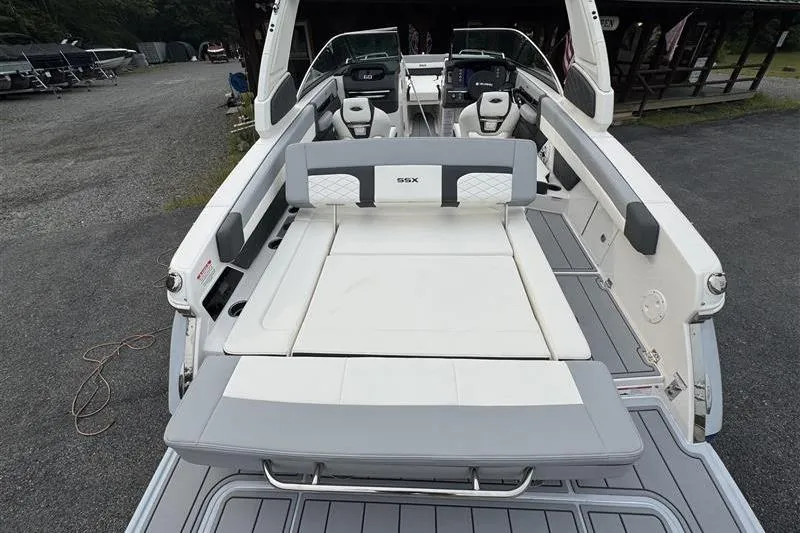 Slide: The Image of 2025 Chaparral 267 SSX boat interior with spacious seating and modern design. - 10