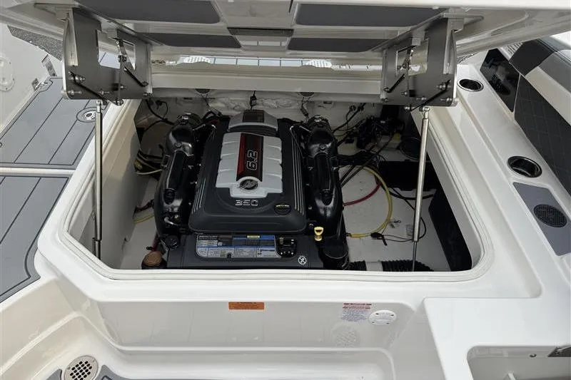 Slide: The Image of 2025 Chaparral 267 SSX boat engine compartment with open hatch. - 13