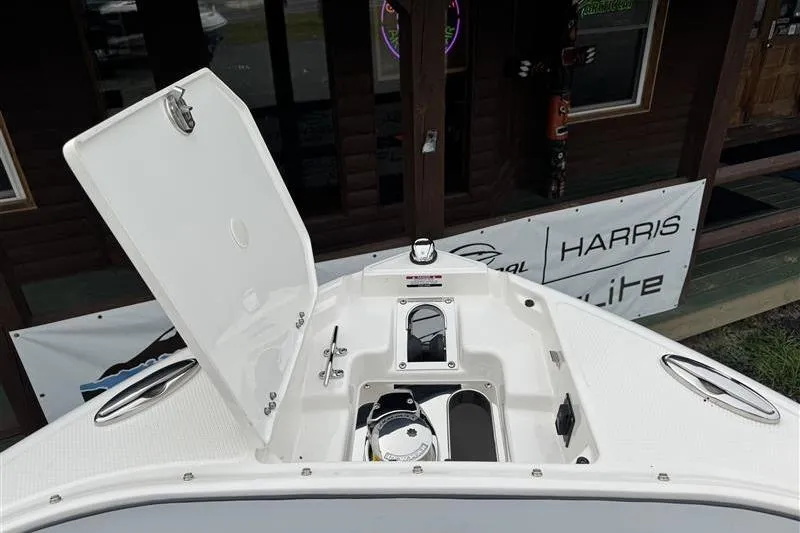 Slide: The Image of 2025 Chaparral 267 SSX boat anchor compartment with open hatch. - 17