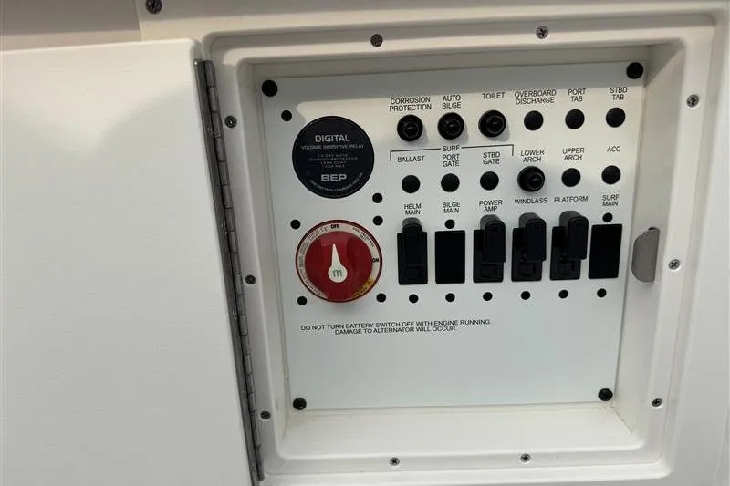 Slide: The Image of Control panel of 2025 Chaparral 267 SSX boat with various switches and indicators. - 18