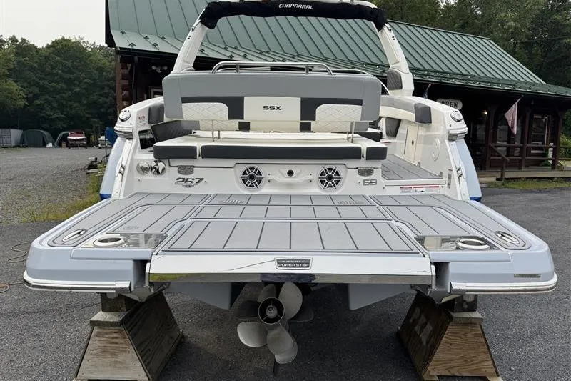 Slide: The Image of 2025 Chaparral 267 SSX boat rear view with swim platform and seating. - 3