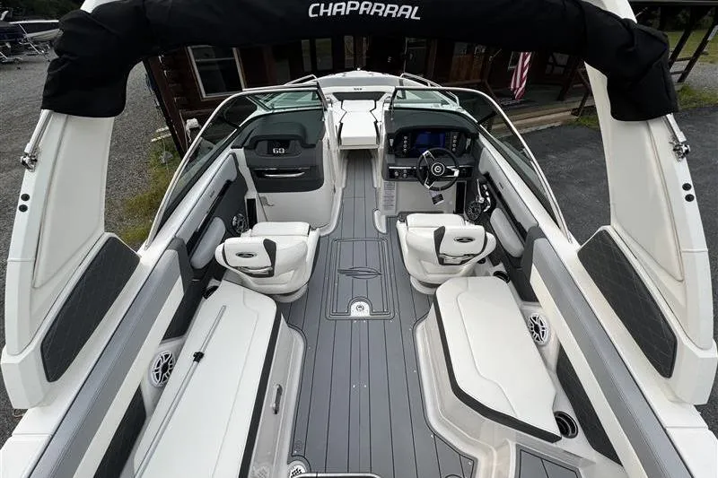 Slide: The Image of 2025 Chaparral 267 SSX boat interior with luxurious seating and modern dashboard. - 9