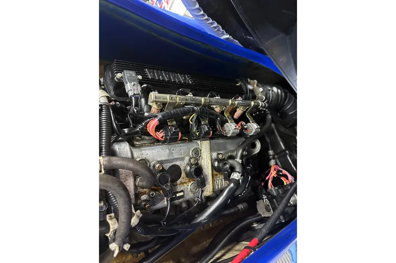 Slide: The Image of Engine of 2011 Yamaha WaveRunner VX Cruiser, showcasing intricate wiring and components. - 10