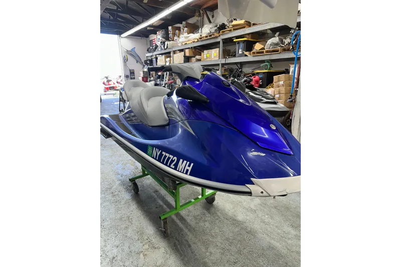 Slide: The Image of 2011 Yamaha WaveRunner VX Cruiser in a garage setting, blue and gray color scheme. - 3