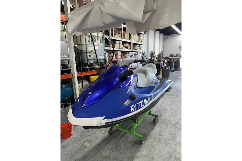 Slide: The Image of 2011 Yamaha WaveRunner VX Cruiser in a workshop setting. - 4
