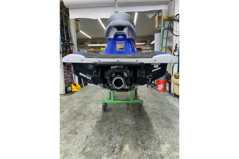 Slide: The Image of 2011 Yamaha WaveRunner VX Cruiser in a workshop setting, rear view. - 5